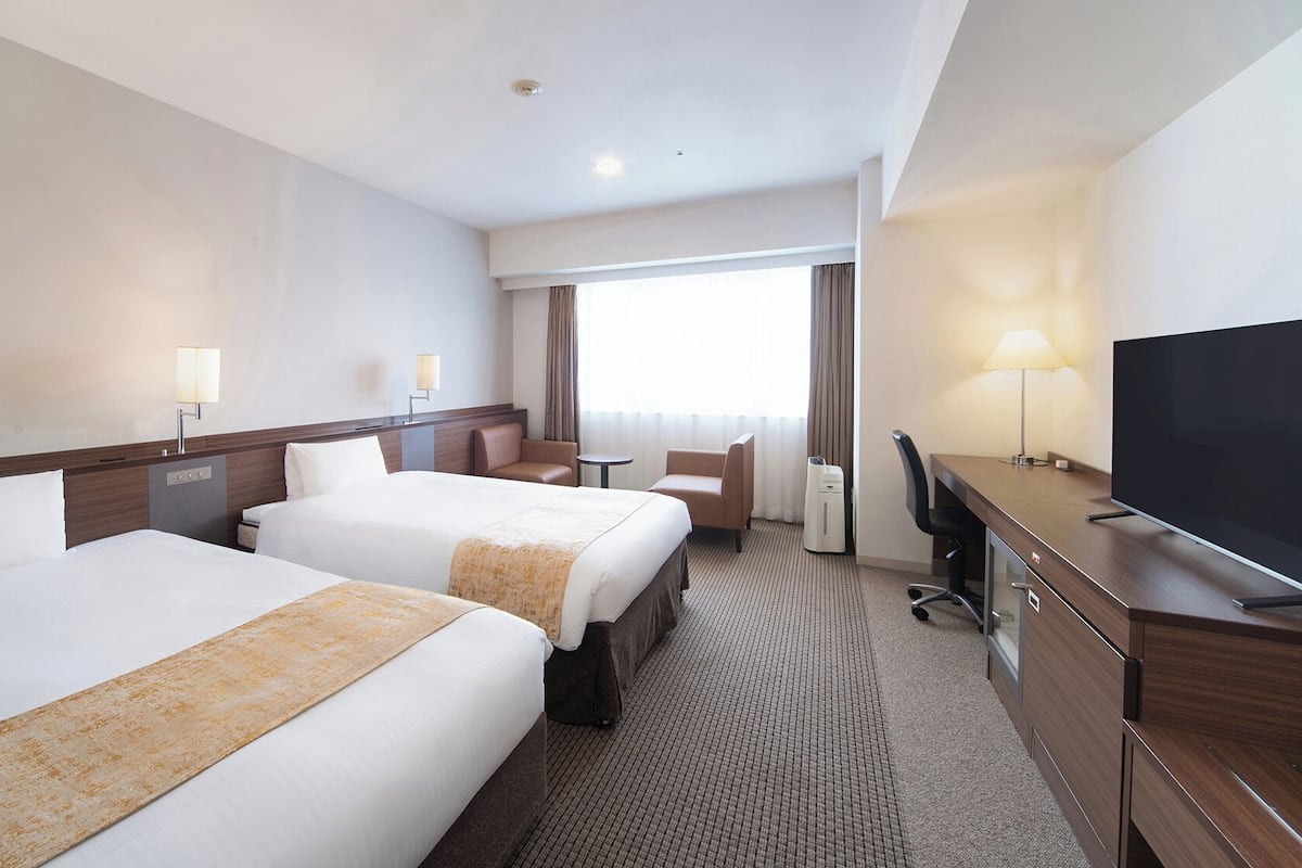 Quarto duplo superior, para não fumantes | Escrivaninha, cortinas blackout, ferros/tábuas de passar roupa