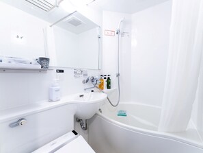 Combined shower/tub, free toiletries, hair dryer, slippers
