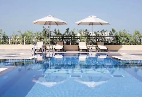 Outdoor pool, open 8:00 AM to 8:00 PM, sun loungers