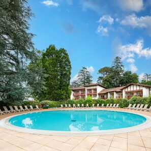 Seasonal outdoor pool, pool loungers