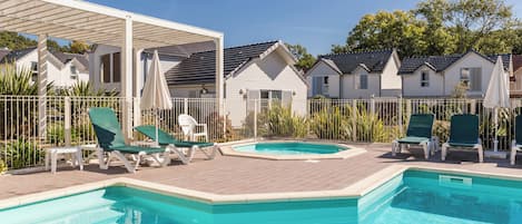 Indoor pool, seasonal outdoor pool, pool umbrellas, pool loungers