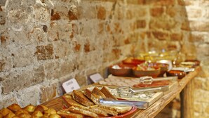 A buffet with various food items and utensils. - Villa Mystique (Belgrade)