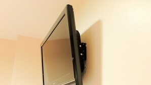 A flat-screen TV mounted on a wall.