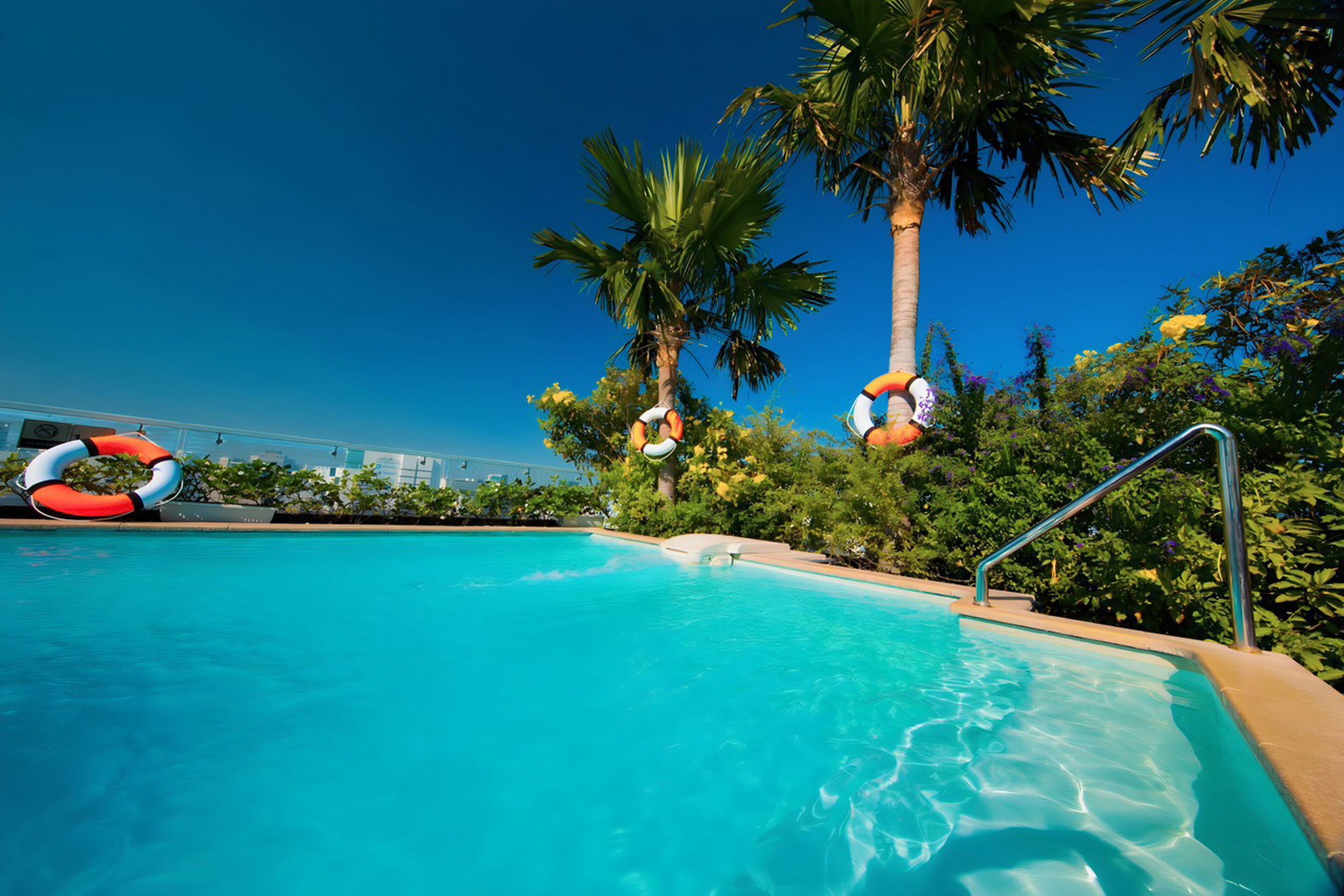 outdoor pool, pool umbrellas, pool loungers