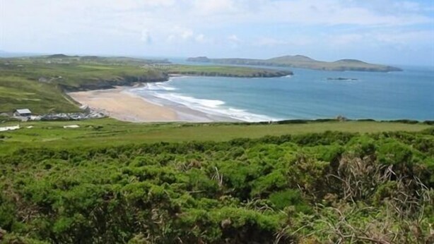 A coastal landscape with a beach, grassy areas, and distant hills. - Llysyfran Farm B&B (Clarbeston Road)