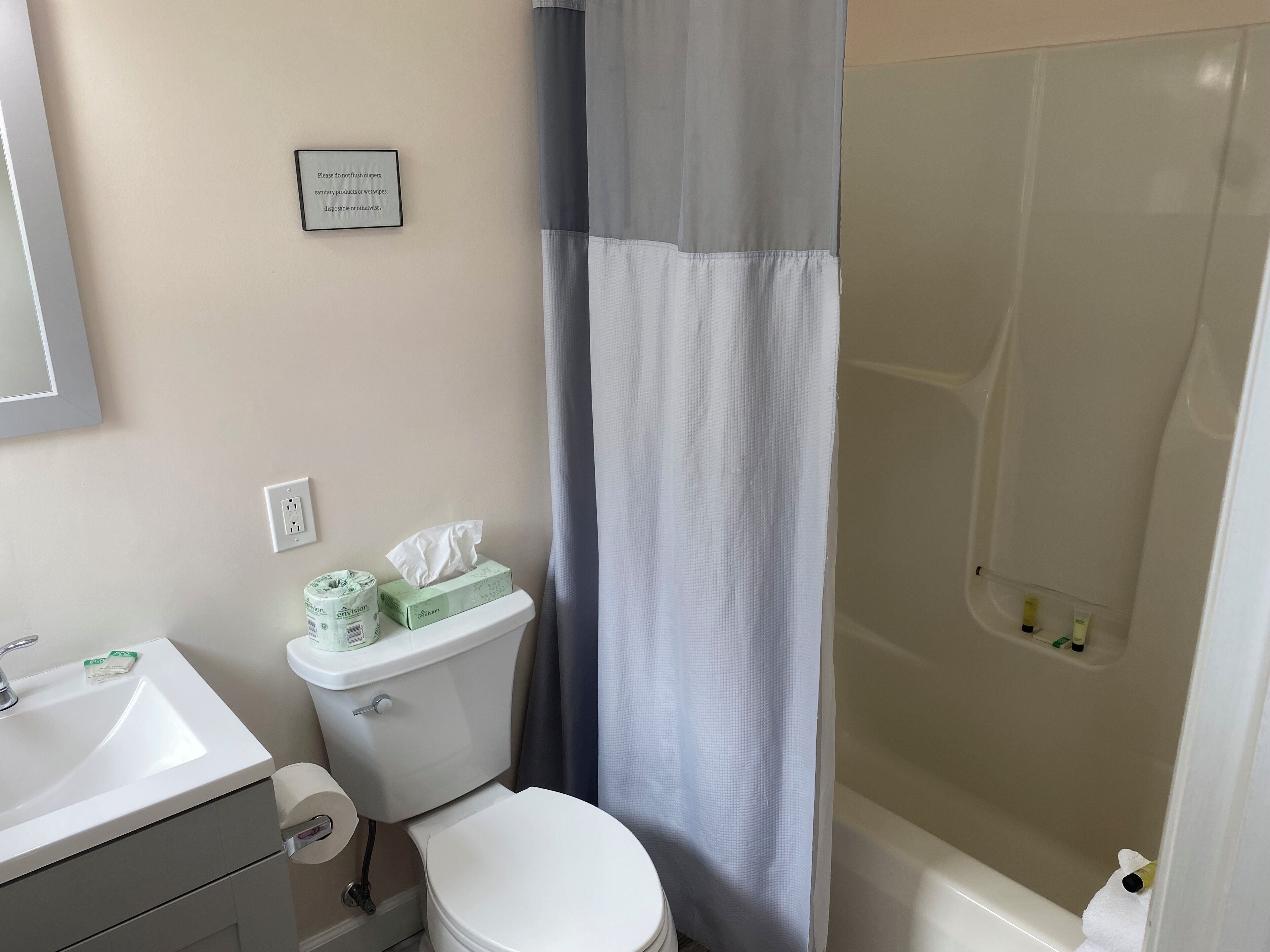 designer toiletries, hair dryer, towels, soap