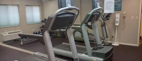 A fitness center with treadmills and exercise equipment.