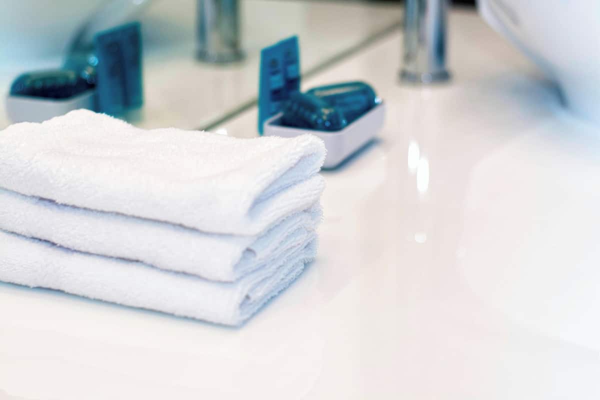 shower, designer toiletries, hair dryer, towels