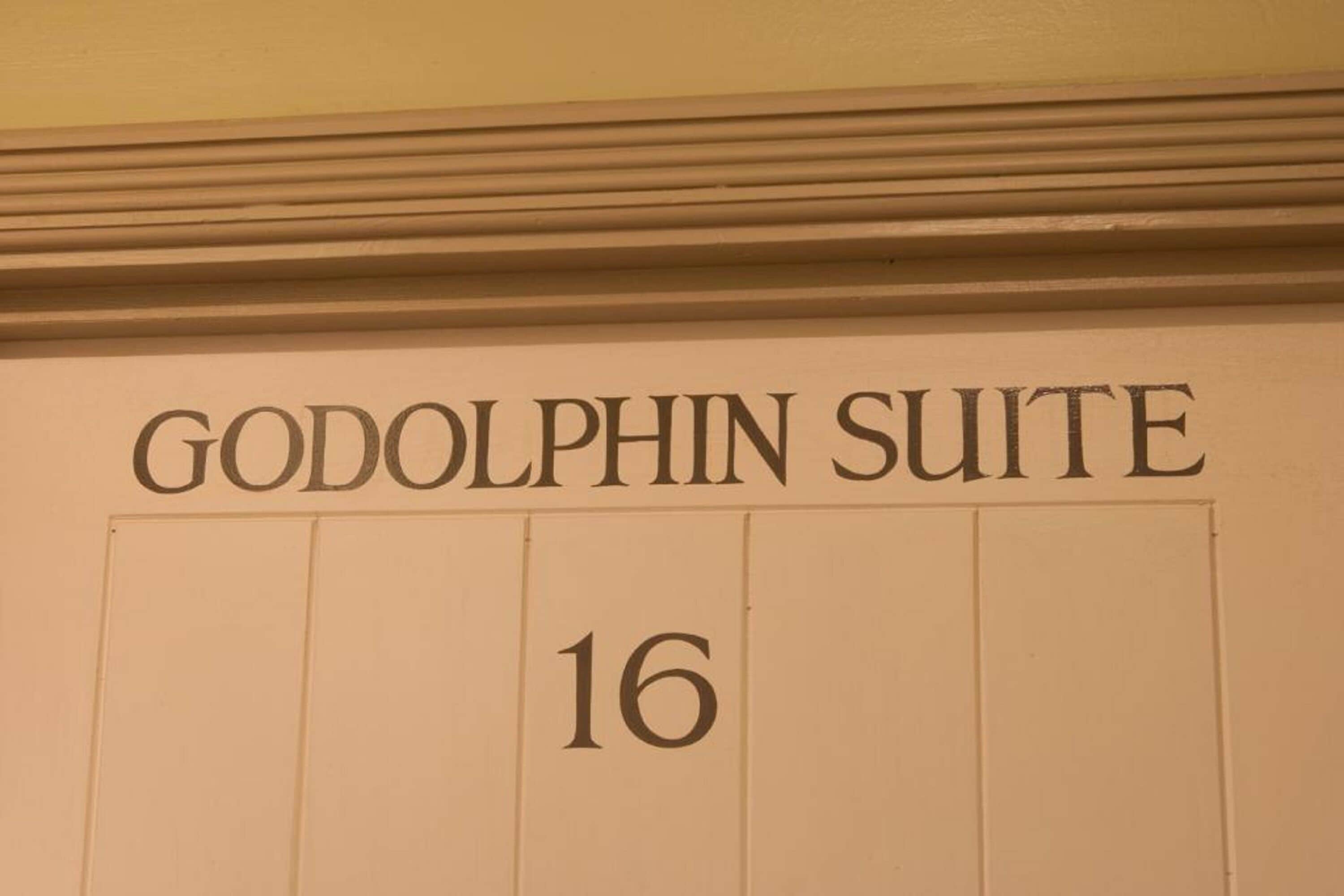 A room number '16' and the name 'GODOLPHIN SUITE' on a wall.