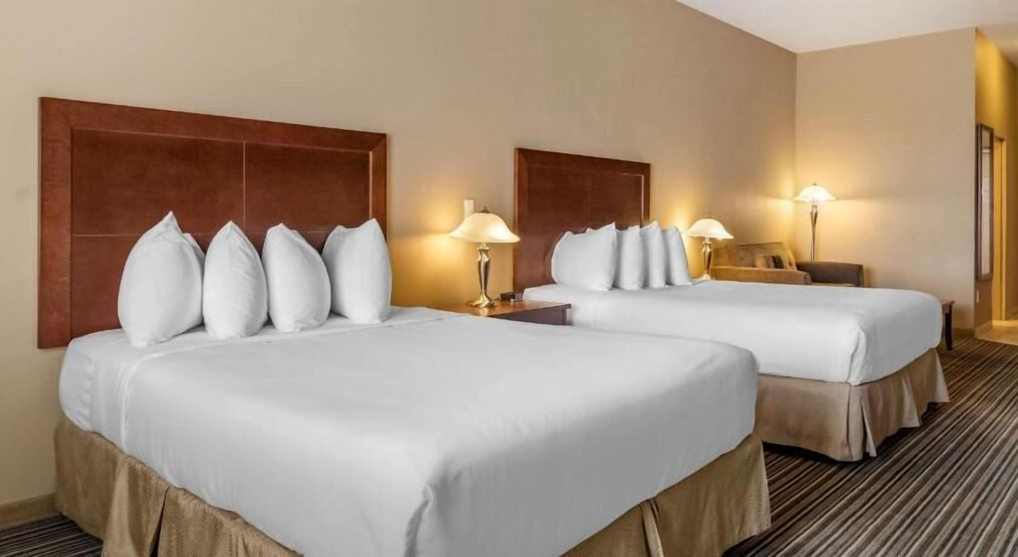 Pillowtop beds, desk, blackout drapes, iron/ironing board