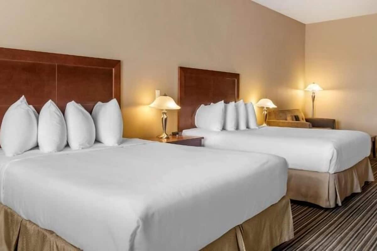 Pillowtop beds, desk, blackout drapes, iron/ironing board