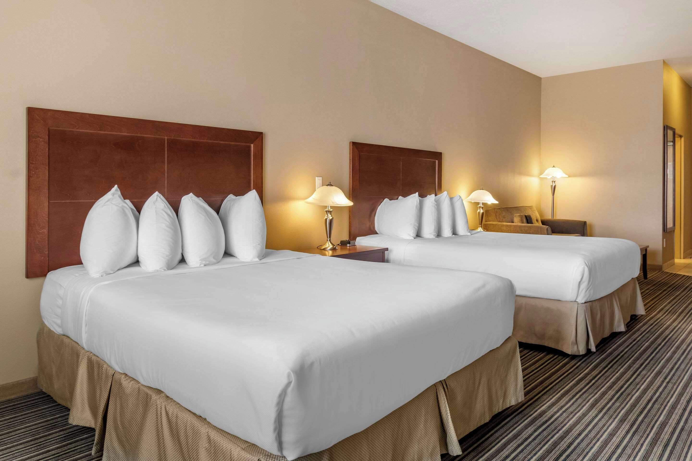 deluxe room, 2 queen beds, non smoking | pillow-top beds, desk, blackout curtains, iron/ironing board