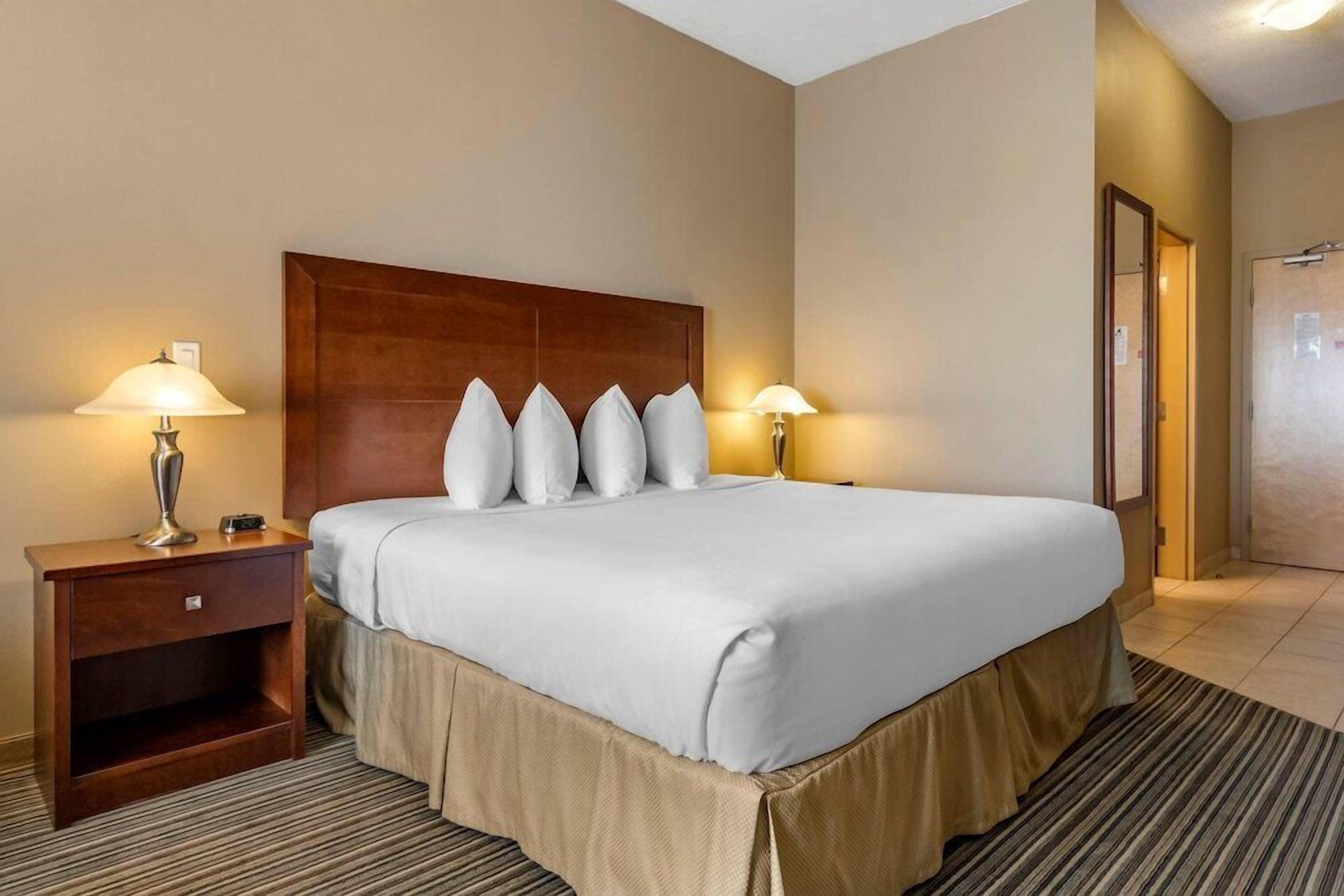 Pillowtop beds, desk, blackout drapes, iron/ironing board