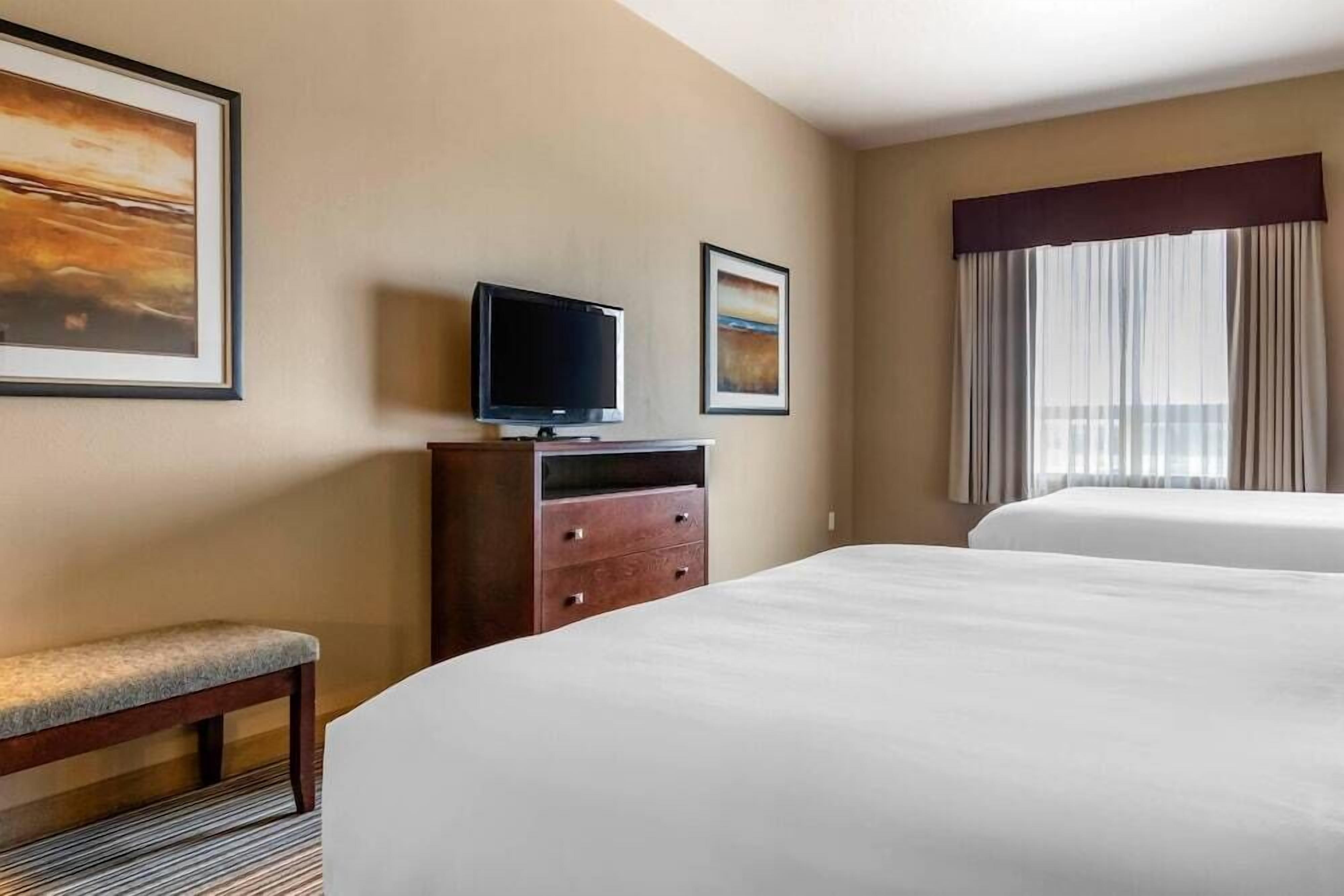 Pillowtop beds, desk, blackout drapes, iron/ironing board