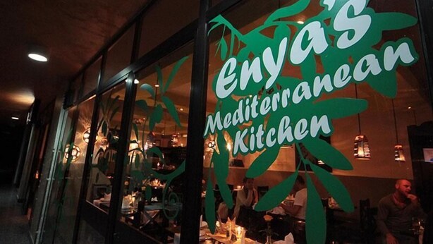 A restaurant named 'Enya's Mediterranean Kitchen' with large green signage. - Haimi Apartment Hotel (Addis Ababa)