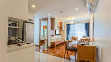 Suite, 2 Bedrooms | Living area | 40-inch LCD TV with cable channels, TV