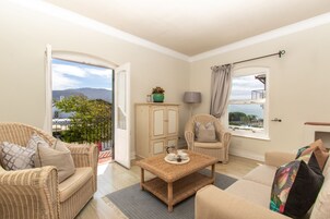 Deluxe Suite, 1 Bedroom, Balcony | Living room | TV