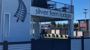 A two-story building with a sign reading "Silver Fern Lodge". - Silver Fern Lodge (Taupo)