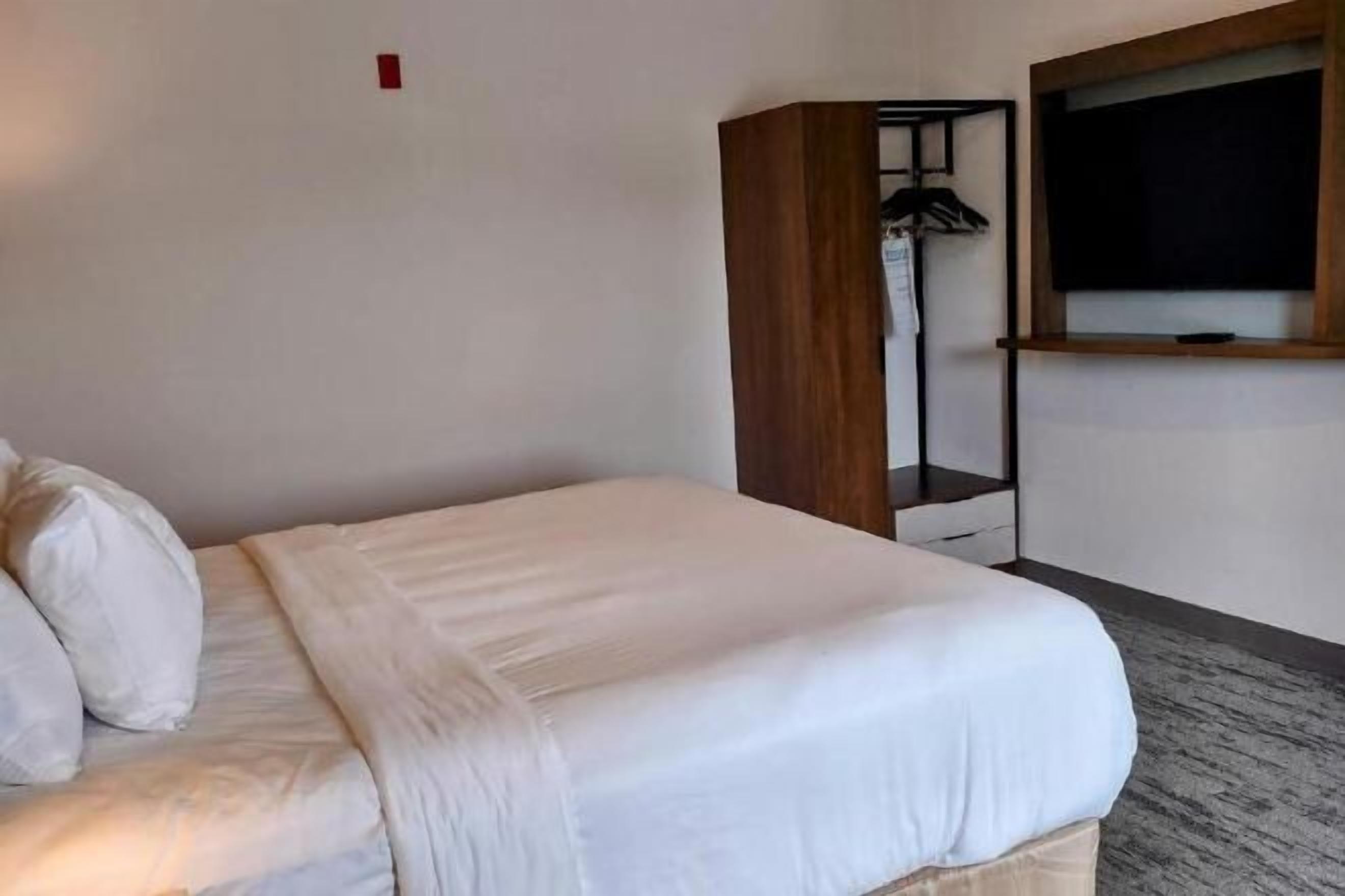 Down duvets, desk, laptop workspace, blackout curtains