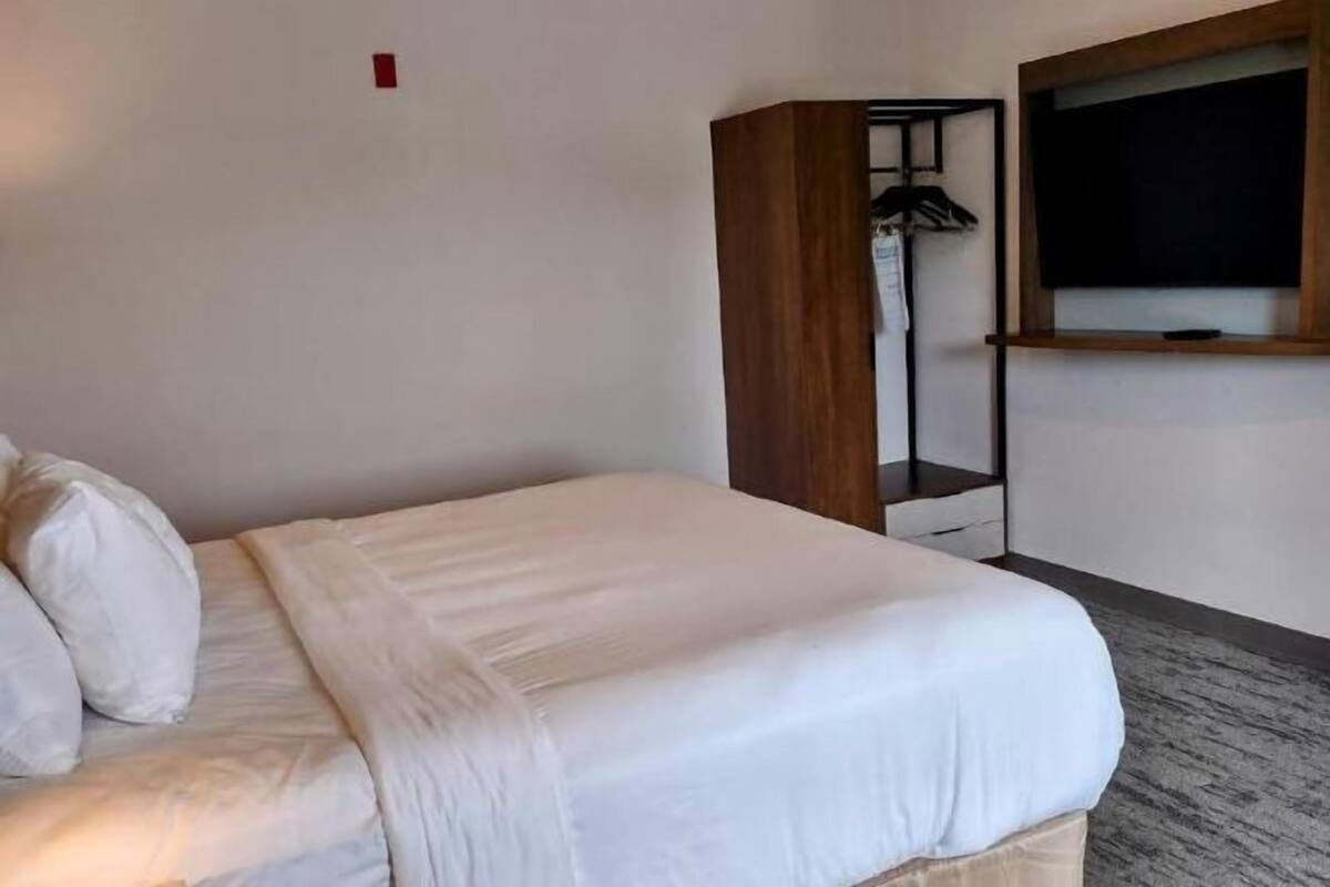 Down duvets, desk, laptop workspace, blackout curtains