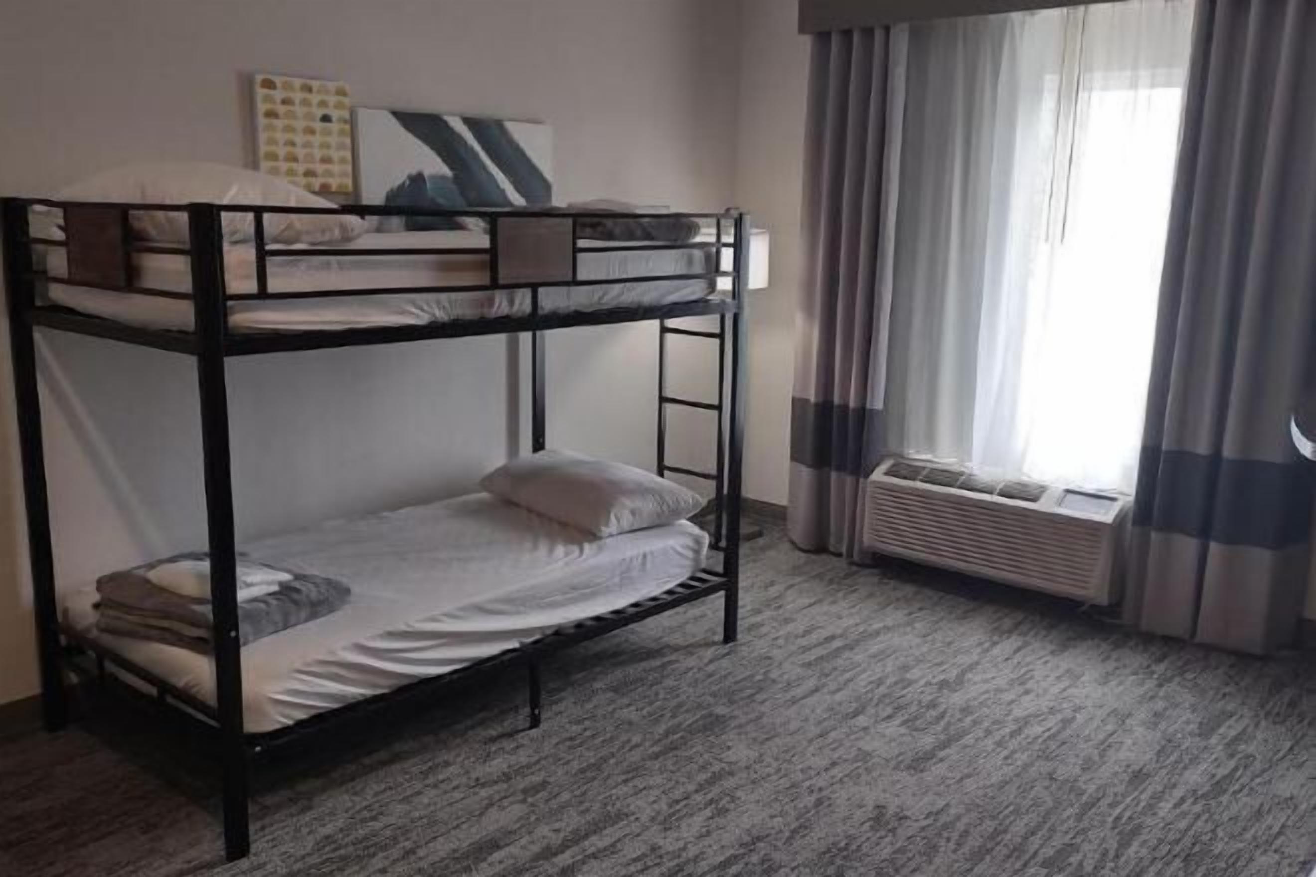 Down duvets, desk, laptop workspace, blackout curtains