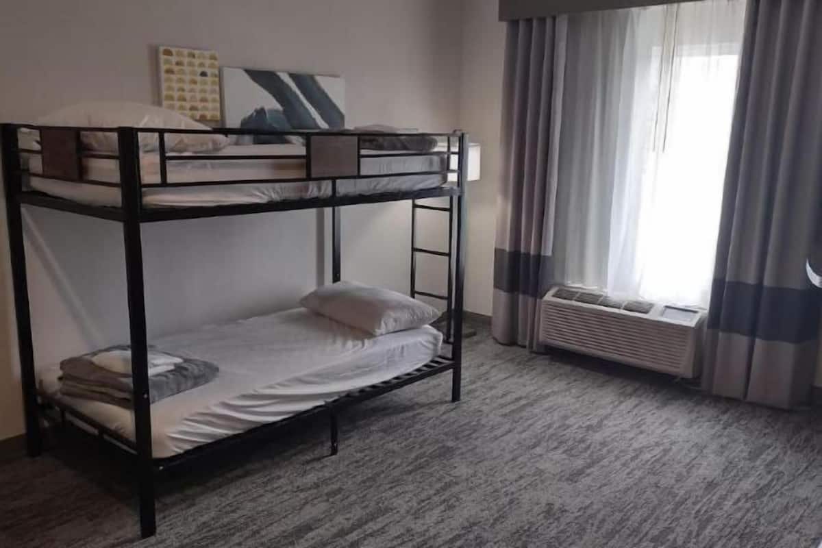 Down duvets, desk, laptop workspace, blackout curtains