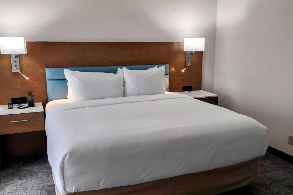 Down duvets, desk, laptop workspace, blackout curtains