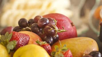 A variety of fruits including strawberries, grapes, and apples.