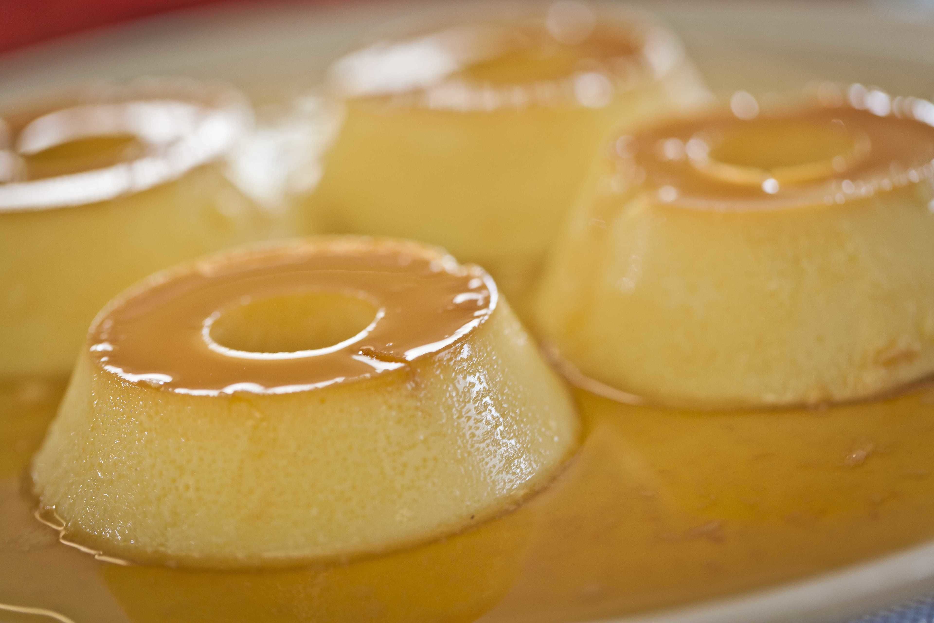 A close-up of caramel flan desserts.