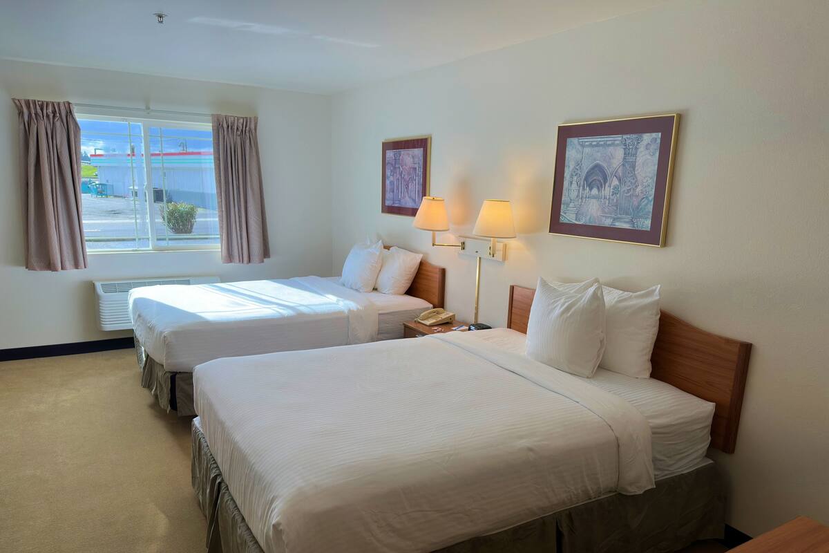 Standard Single Room, 2 Queen Beds, Non Smoking | Blackout drapes, iron/ironing board, WiFi (free), bed sheets