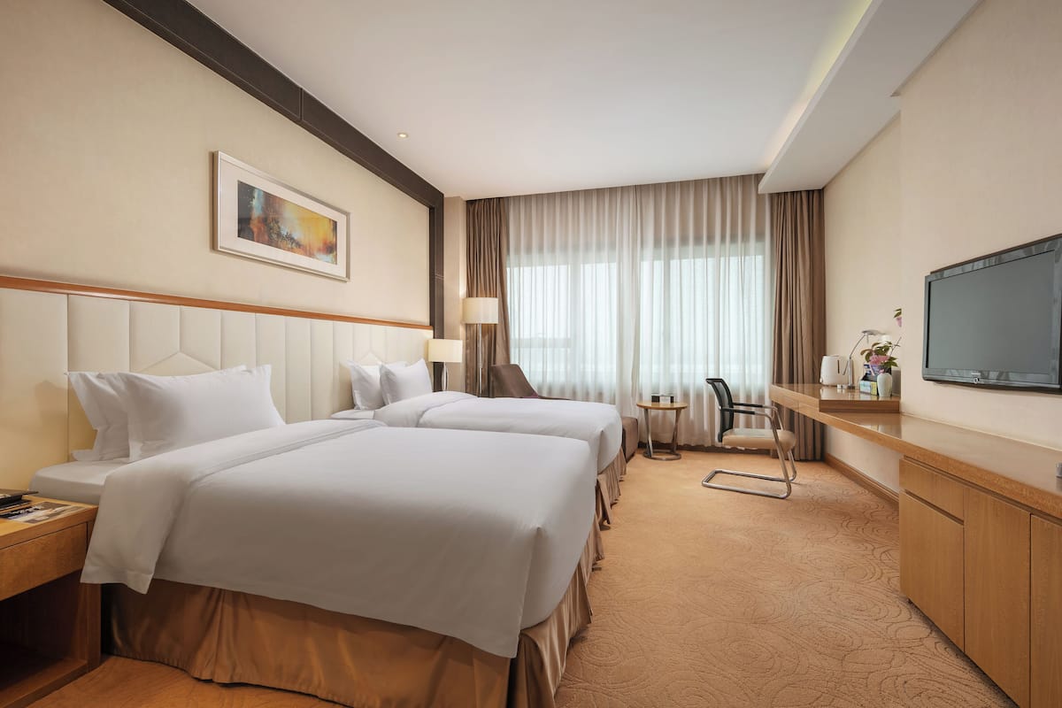 executive twin room | in-room safe, desk, blackout curtains, iron/ironing board