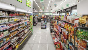A supermarket aisle with shelves stocked with various food items and beverages. - Landison Airport Hotel HangZhou (Hangzhou)