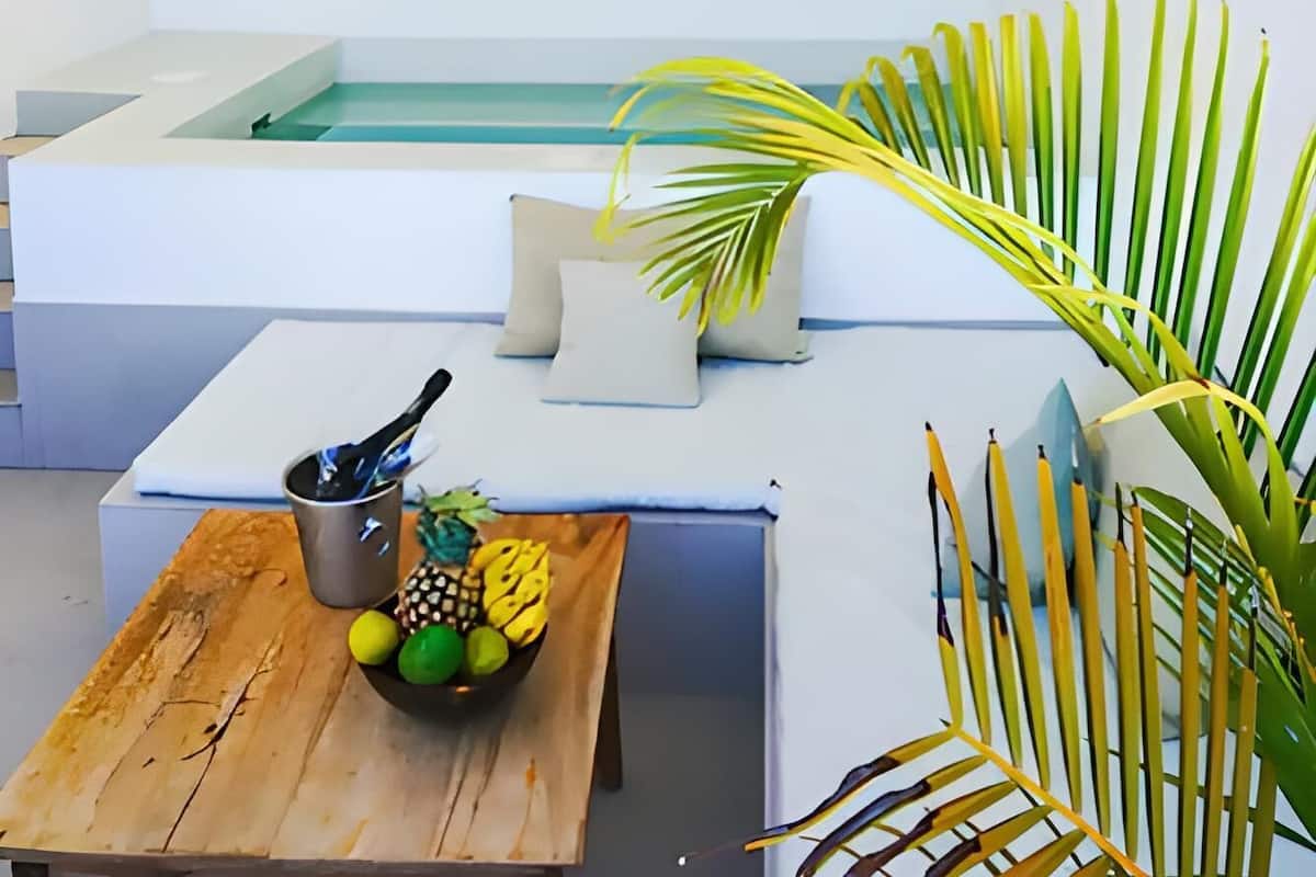 A modern kitchen with a wooden table, a sink, and a countertop.