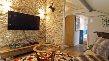 Deluxe Apartment, 4 Bedrooms | Living area | 32-inch flat-screen TV with satellite channels, TV