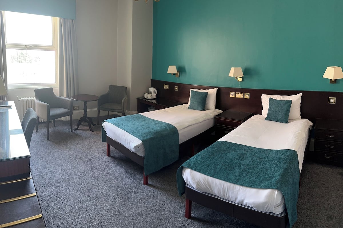 Standard Twin Room, Partial Sea View | 1 bedroom, individually decorated, individually furnished, desk