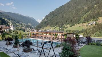 Indoor pool, seasonal outdoor pool, pool umbrellas, pool loungers