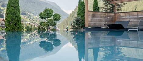 Indoor pool, seasonal outdoor pool, pool umbrellas, sun loungers