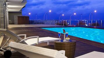 Seasonal outdoor pool, pool umbrellas, pool loungers