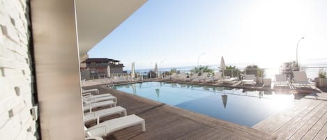 Seasonal outdoor pool, pool umbrellas, sun loungers