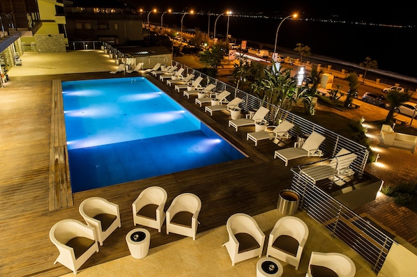 Seasonal outdoor pool, pool umbrellas, pool loungers
