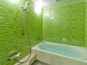 Separate bathtub and shower, free toiletries, hair dryer, slippers