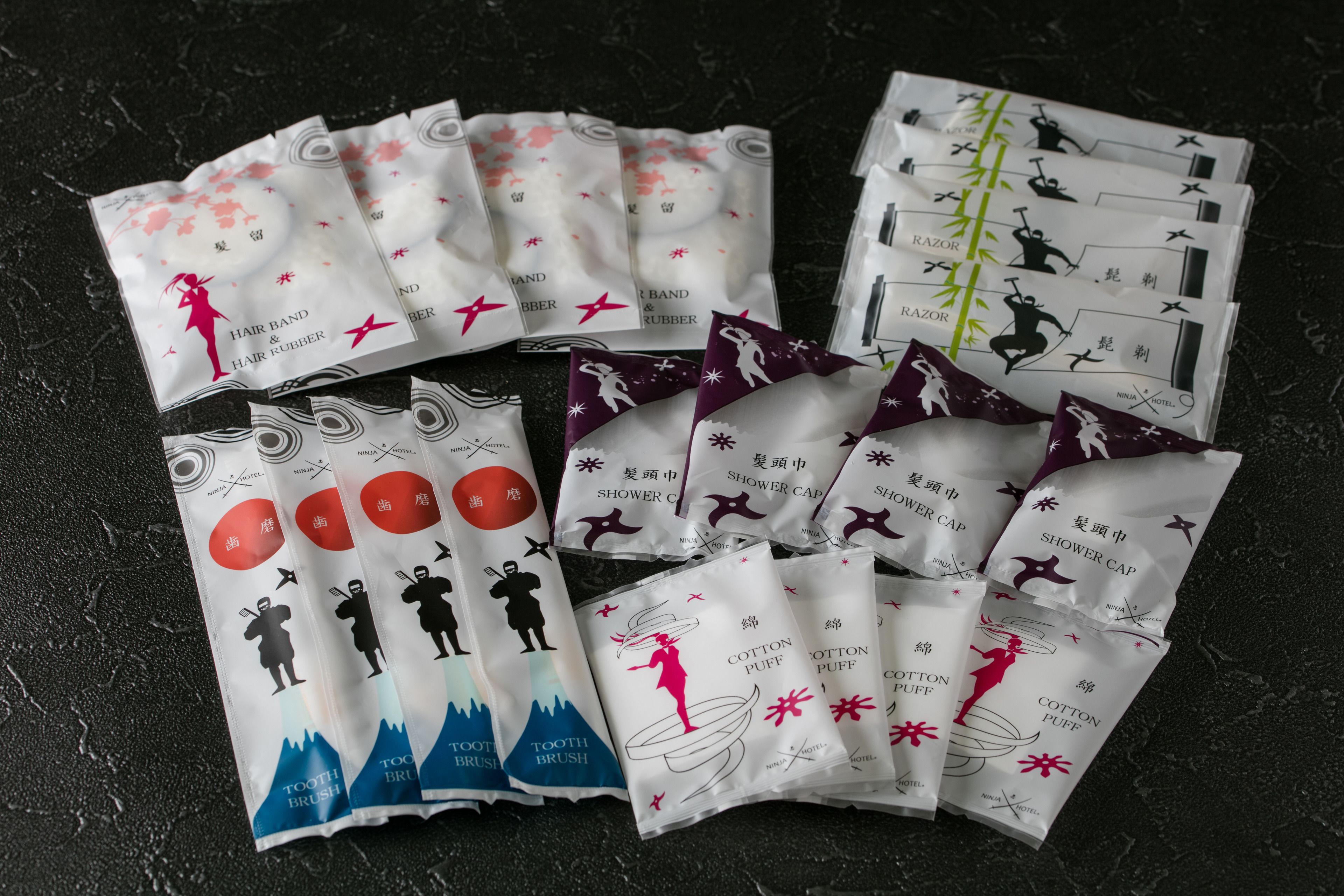 Various toiletries in different packaging, including hair band, hair rubber, razor, shower cap, cotton puff, and toothbrush.