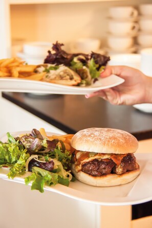A meal with a burger and fries, and a plate of salad. - Sandbanks Hotel (Poole)