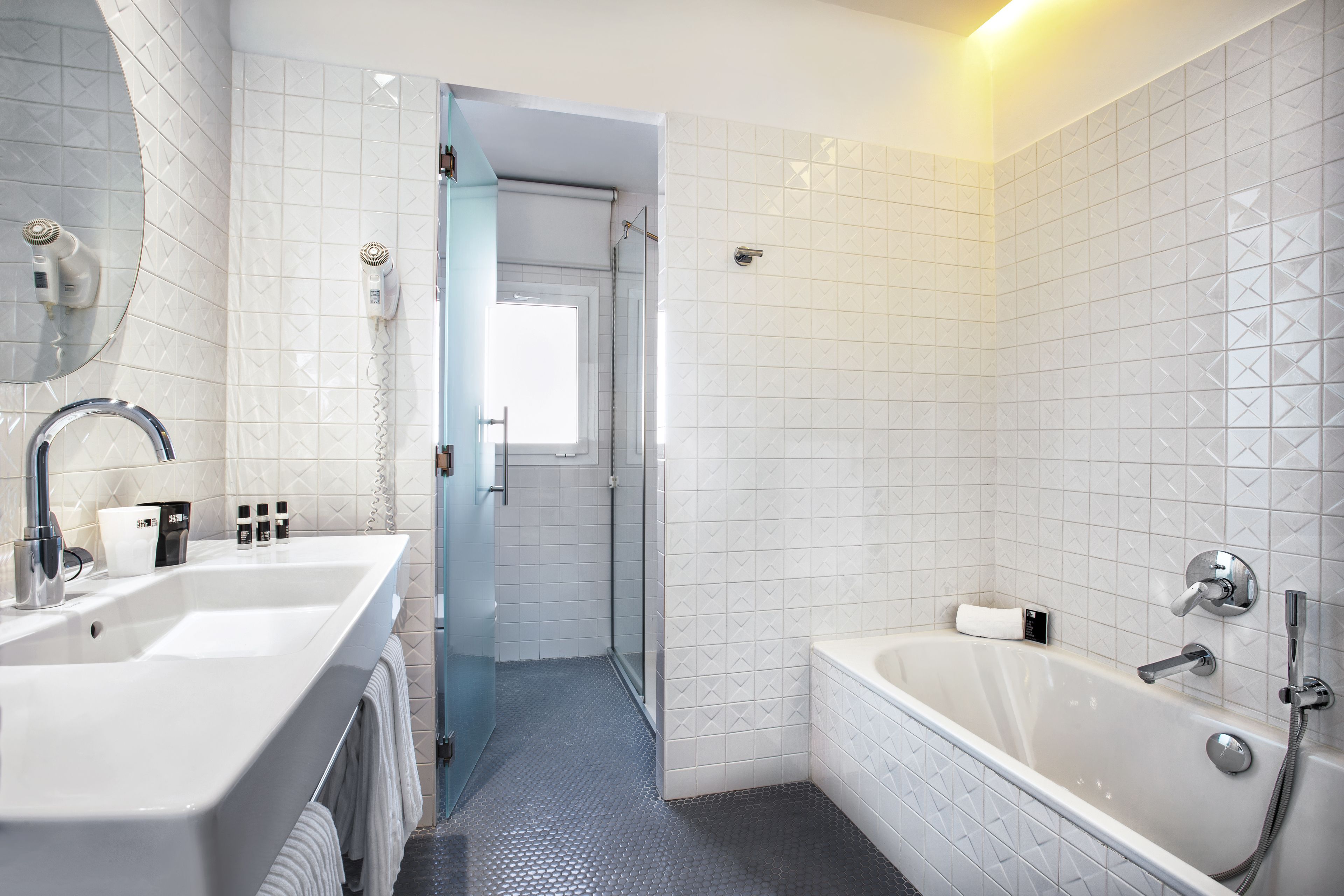 hydromassage showerhead, designer toiletries, hair dryer, towels