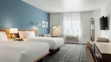 Deluxe Suite, Multiple Beds | Desk, laptop workspace, blackout drapes, iron/ironing board