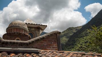 A building with a tiled roof and a dome structure.