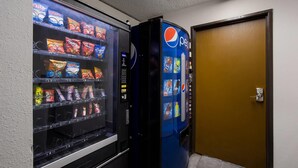 A vending machine with snacks and a Pepsi dispenser. - Quality Inn Hall of Fame (Canton)