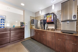 A modern kitchen with a coffee station, a refrigerator, and a microwave. - Best Western Plus Miami Airport North Hotel & Suites (Miami Springs)