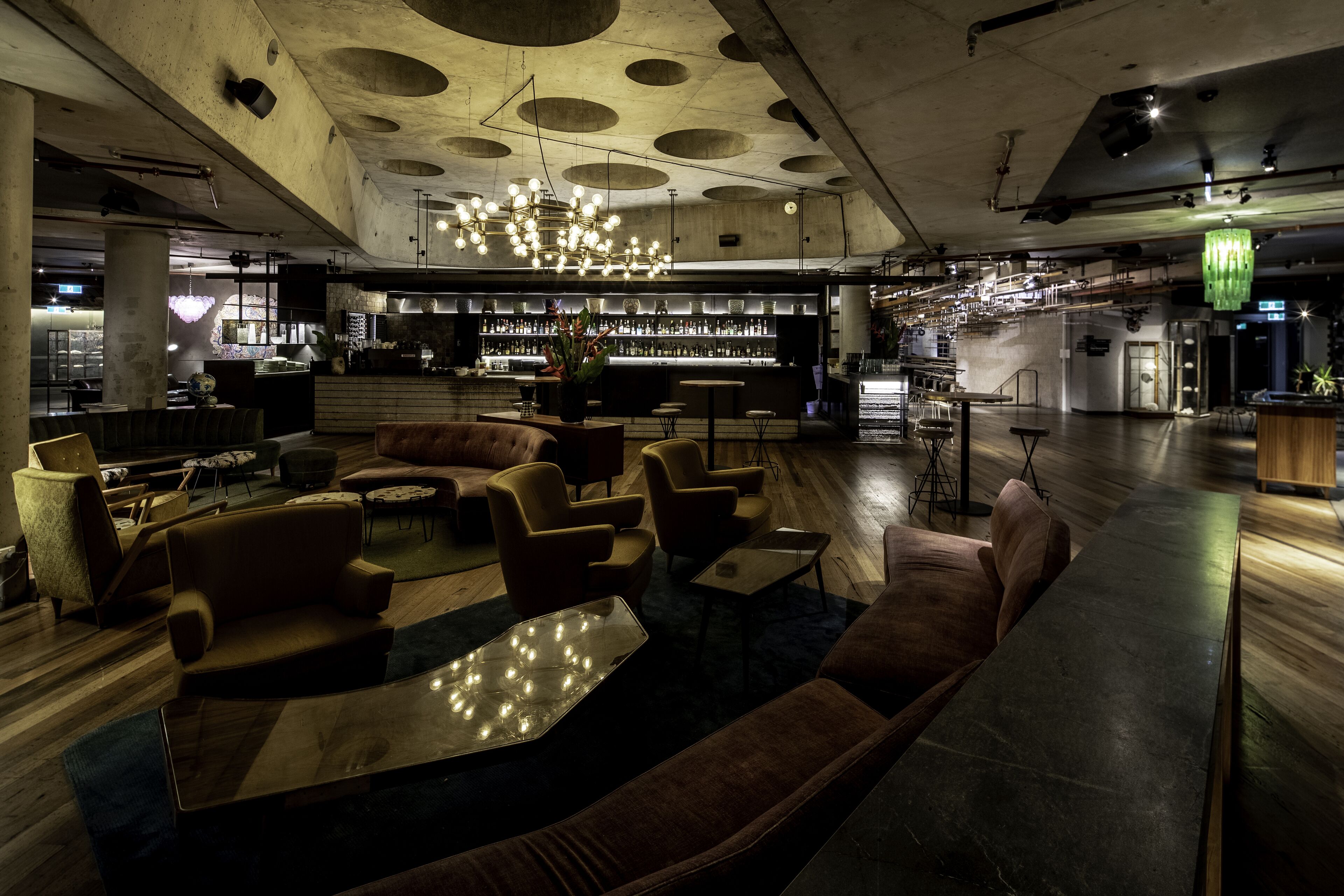 A spacious lounge area with sofas and a bar.