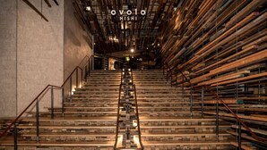 A staircase made of wooden planks with metal railings, leading to a higher floor. - Ovolo Canberra, a Wyndham Hotel (Canberra)